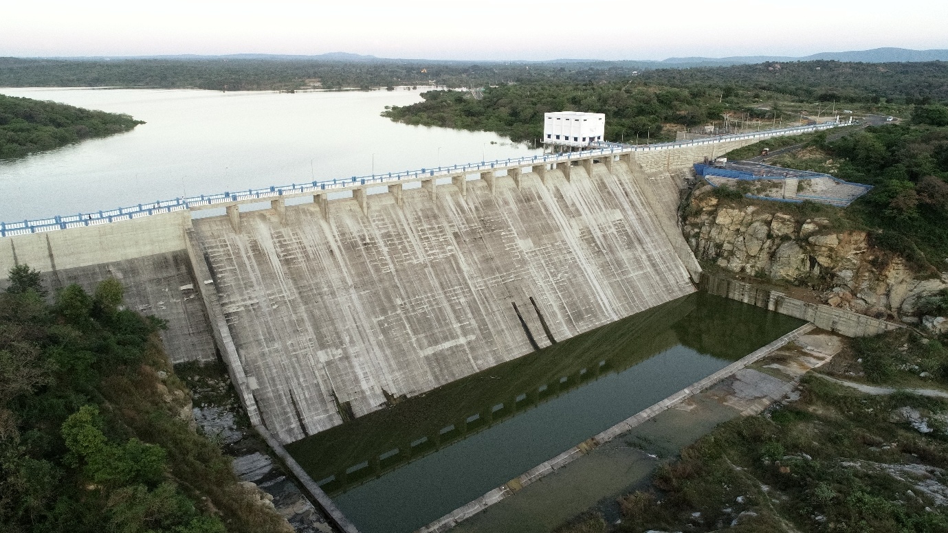 Aerial view of a river barrage with regulator gates